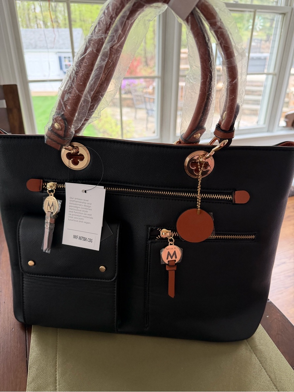 New SM New York Black vegan leather Tote with Brown Accents & Gold Hardware